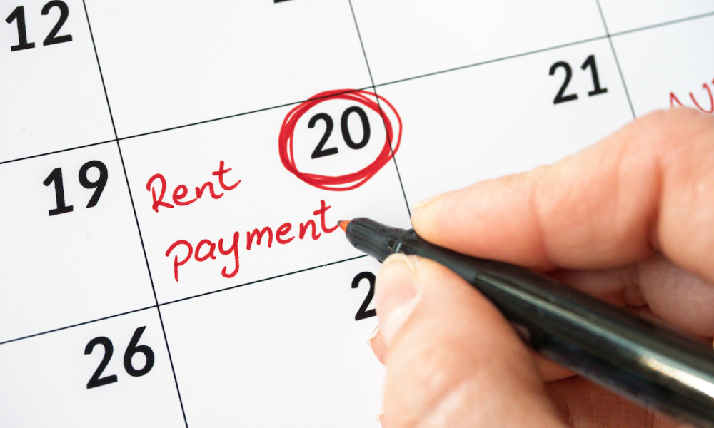 hand writing rent on calendar page