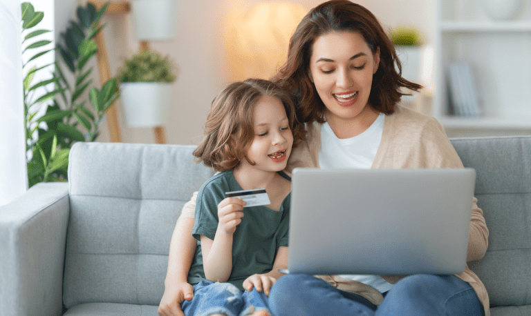 woman and child with laptop and credit card
