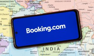 AI Cuts Booking Holdings Customer Service Costs 10% as Volumes Rise
