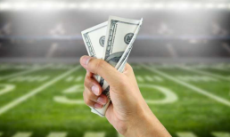 fist with cash at sports field