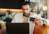 man with laptop and credit card