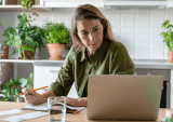 woman with laptop and papers