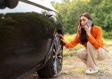 woman with flat tire