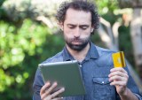 man with tablet and credit card