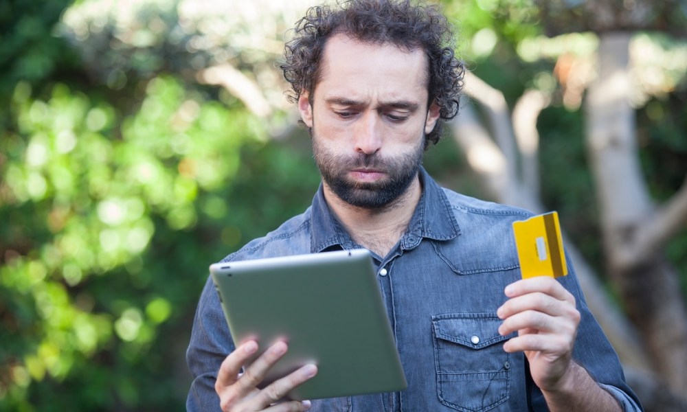 man with tablet and credit card