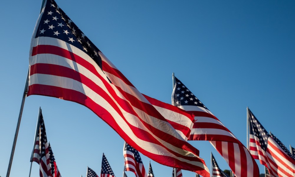 American flags against blue sky