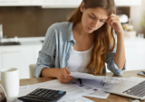 woman looking at bills
