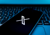 X app on phone atop keyyboard