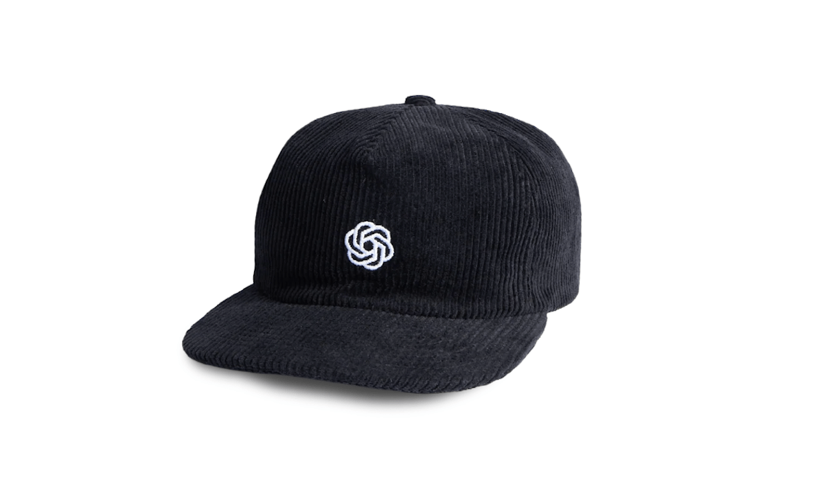 AI’s Biggest Flex Isn’t a Model. It’s a Cap.