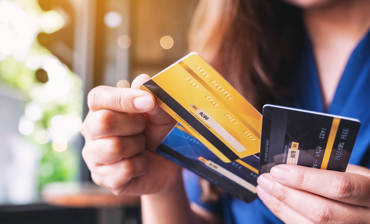 woman holding credit cards