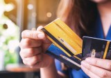 woman holding credit cards
