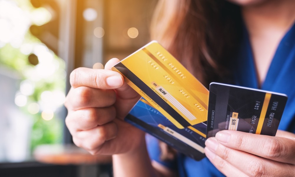 woman holding credit cards
