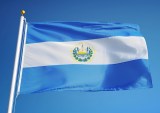 El Salvador flag waving against blue sky
