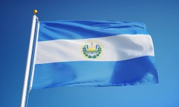 El Salvador flag waving against blue sky